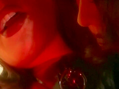 A Stunning Lady In A Latex Dress Satisfies Another Lady With Her Sex Toy