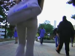 A brunette with appetizing ass in the street candid video
