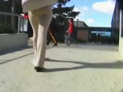 A brunette with appetizing ass in the street candid video