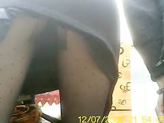 Amateur bends over showing black pantyhose upskirt