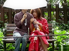 Asian babe in kimono enjoys the outdoors