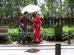 Asian babe in kimono enjoys the outdoors