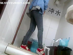 Asian girl with funny hat peeing