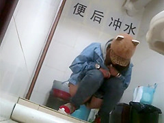 Asian girl with funny hat peeing