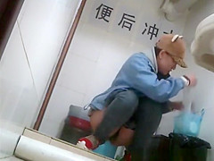 Asian girl with funny hat peeing