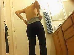 Asian spied dressing in bathroom