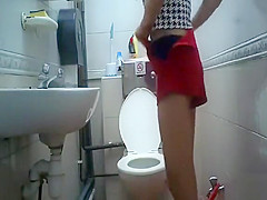 Asian student 18+ taking a pee in the college WC