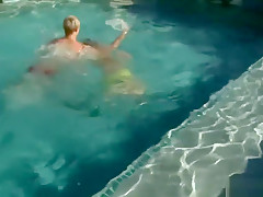 Athletic stud sucking cock in the pool