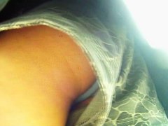 Blonde cutie treats us to an up skirt view of her ass