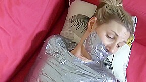 Blonde mummified on sofa