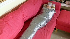 Blonde mummified on sofa