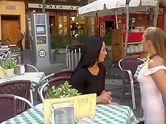 Brunette smoking in public cafe outdoor