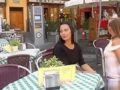 Brunette smoking in public cafe outdoor