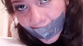 Busty Trapped and Bound with Nipples Clamped and Mouth Taped
