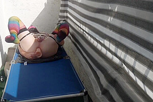 Caged Sissy Plays With Her Dildo On Public Balcony