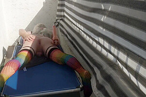 Caged Sissy Plays With Her Dildo On Public Balcony