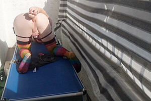 Caged Sissy Plays With Her Dildo On Public Balcony