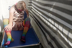 Caged Sissy Plays With Her Dildo On Public Balcony