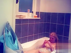 Foxy blonde with perky tits enjoys masterbating in the bathroom
