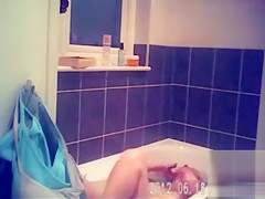 Foxy blonde with perky tits enjoys masterbating in the bathroom