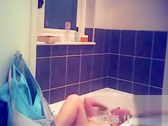 Foxy blonde with perky tits enjoys masterbating in the bathroom