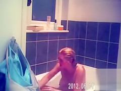 Foxy blonde with perky tits enjoys masterbating in the bathroom