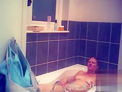 Foxy blonde with perky tits enjoys masterbating in the bathroom