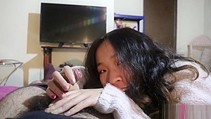 Hot Chinese girlfriend gives an oiled handjob POV
