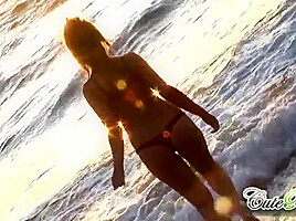 Hot babes on the beach teasing the camera