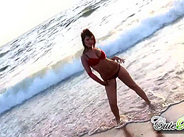 Hot babes on the beach teasing the camera