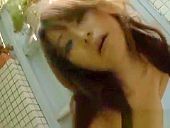 Japanese babe tames a huge dick