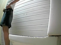 Jeans skirt woman caught peeing