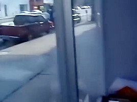 Mature woman sucks dick in office with a big window to the street
