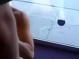 Mature woman sucks dick in office with a big window to the street