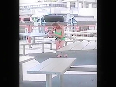 My friend's wife on her phone at the tables