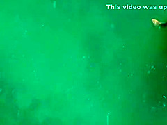 Nude couple fucking in water