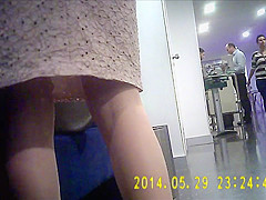 Office woman in very shiny tan pantyhose