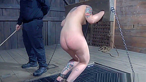 Restrained fem slave caned as punisment