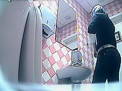 Sexy brunette takes a pee