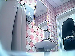 Sexy brunette takes a pee