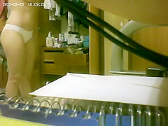She gets spied putting on panties