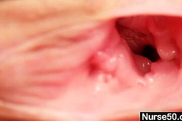 Skinny milf senior nurse toys her pussy on gynochair