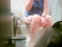 Smooth round butt of a pissing girl