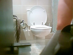 Smooth round butt of a pissing girl