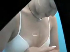 Sweetie putting on her lingerie in change cabin