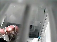 Tan lined female got her nude boobs on shower