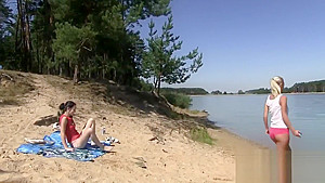 Two hot lesbians bang at the beach