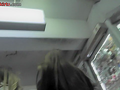 Upskirt shots of auburn-haired gals in a public place