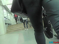 Upskirt shots of auburn-haired gals in a public place