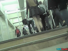Upskirt shots of auburn-haired gals in a public place